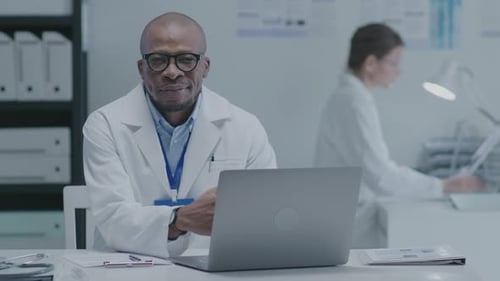 Black Doctor Working in Clinic