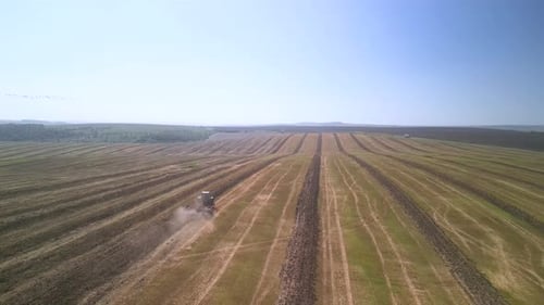 Tractor working on the field doing tillage with cultivator