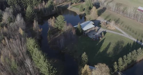 Scenic Aerial View of Rural House Beside Pond