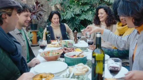 Friends Laughing Together at Outdoor Lunch