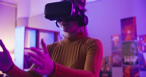 Woman plays VR with a headset indoors