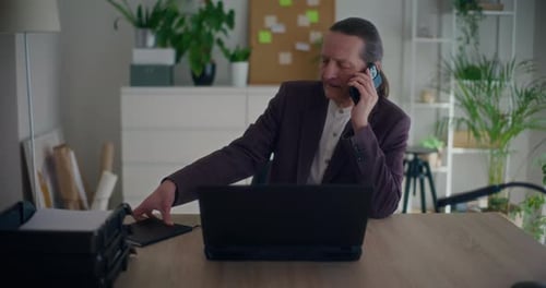 Adult Man Working at Desk in Home Office