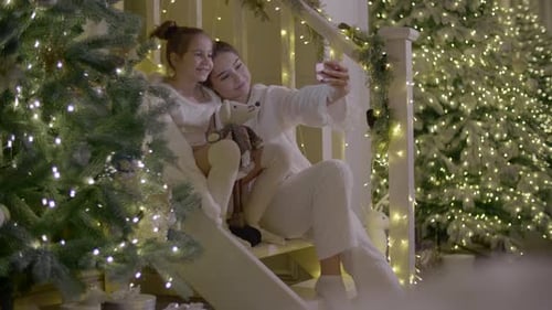 Family Selfie on Cozy Christmas Decorated Staircase