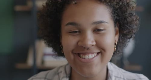 Close-up Portrait of a Smiling Young Woman