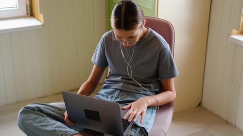 Teen Girl School Student Wear Headphones Watching Online Webinar Talking Through Webcam Looking at