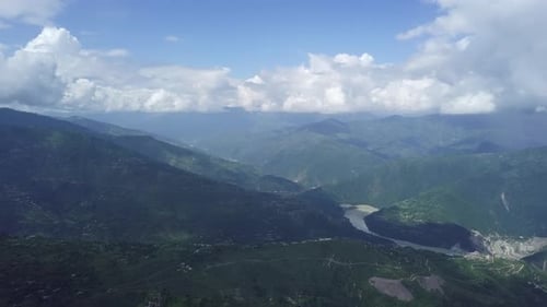 Experience the Stunning Mountain Landscape Adorned with Lush Greenery and Dramatic Clouds Stock Clip