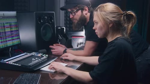 Woman Types as Man Gestures in Studio
