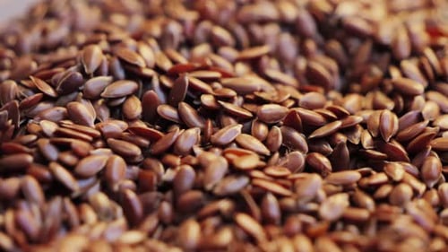 Heap of Brown Flax Seeds Close Up Nutrition Healthy Food and Organic Food