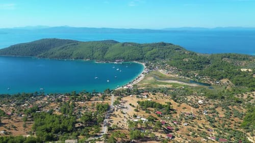 Beautiful view of the beach with boats, pure nature, sea and ships. Shot from a drone