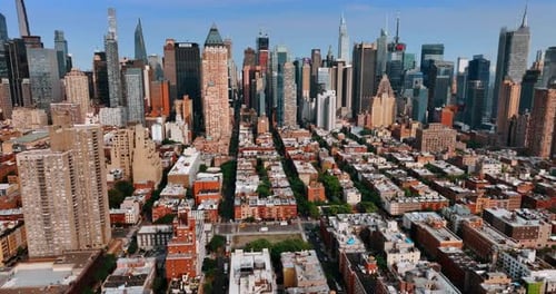 Approaching gorgeous skyscrapers in the New York midtown. Sunny panorama of the city