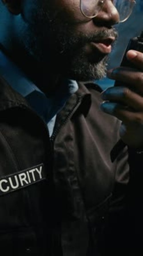 Security Guard Using Radio for Communication at Night