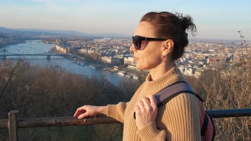 Woman Enjoying City View from Elevated Vantage Point