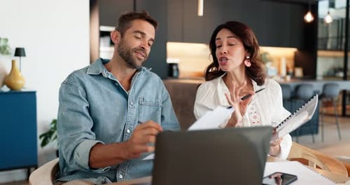 Couple Discussing Finances at Home Office Table