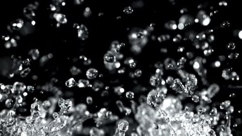 Water Droplets Rise and Fall on a Black Background Filmed on a Highspeed Camera at 1000 Fps