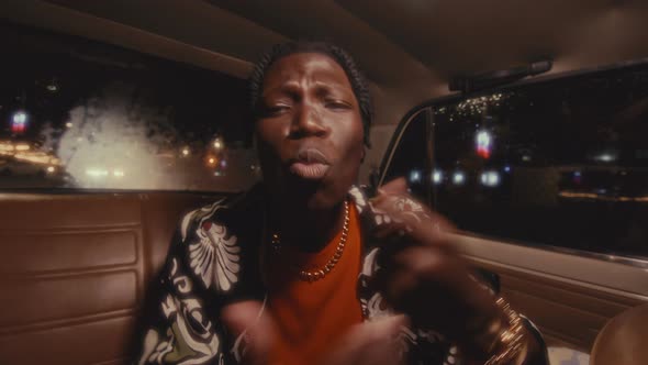 Black Hip-Hop Performer Rapping to Camera during Car Ride in City ...