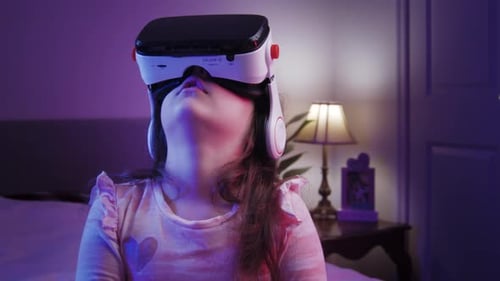 Child Exploring Virtual Reality in Bedroom at Night