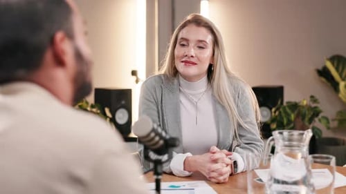 Woman Speaking Into Microphone During Interview