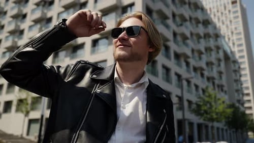 Stylish Man in Sunglasses in Urban Setting