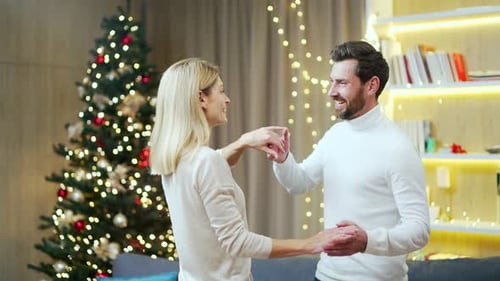 romantic couple in love husband and wife dancing together on christmas eve celebrating new year