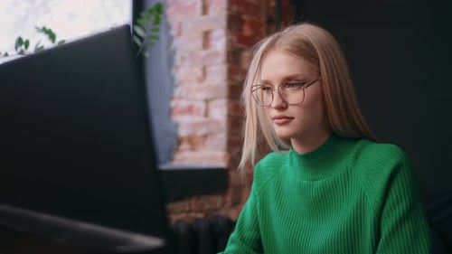 Portrait Of Beautiful Blonde Woman At Computer Working In Modern Office Female Programmer