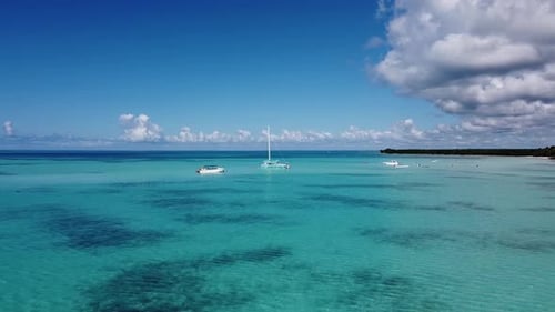 Drone shot of the catamaran in Caribbean sea by Isla Saona in Dominican Republic