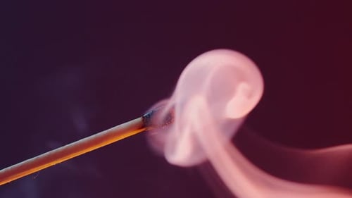 A Burning Match Goes Out and Leaves White Smoke
