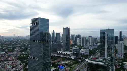 Panoramic cityscape of Indonesia capital city Jakarta at sunset.