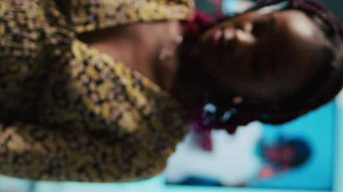 Woman Sorting Through Clothes in Apartment