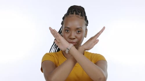 Black woman, stop sign and hands for portrait in studio with body language, x signal and warning