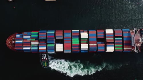 Top Down Aerial View of a Massive Cargo Ship Carrying Multi Colored Containers
