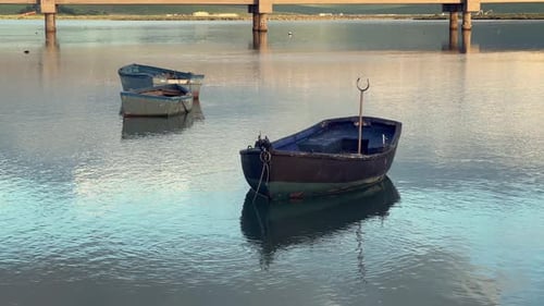 Fishing boats floating on calm water in barbate, andalusia, spain