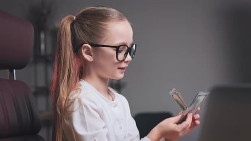 Blonde Girl with Money in Office Workplace
