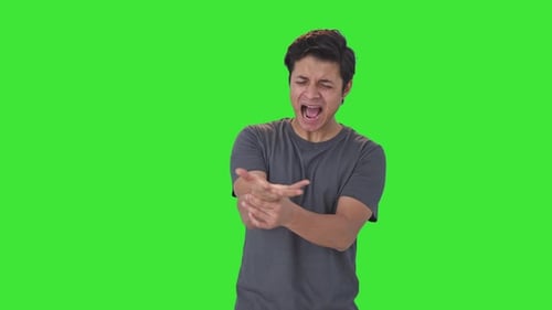Indian man suffering from wrist pain Green screen
