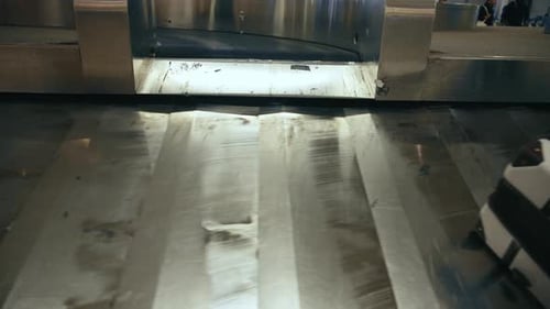 The Baggage Carousel Located at the Airports Luggage Claim Area