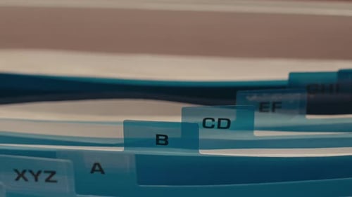 File Box with Documents Sorted by Index Cards in Alphabetical Order