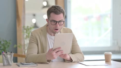 Young Adult Receives Shocking News on Tablet