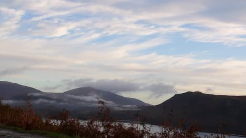 Beautiful time lapse of clouds flowing over mountains in the Lake District National Park Cumbria Uni
