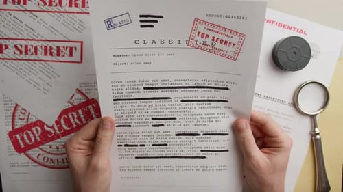 Holding Classified Document with Redactions