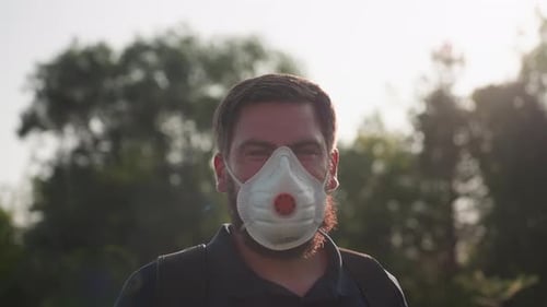 Adult Man Wearing a Mask Outside