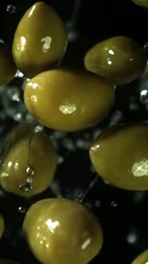 The Olives Fly Up and Fall Down Filmed on a Highspeed Camera at 1000 Fps