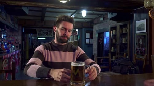 Man Joyfully Highfives Bartender at Lively Pub