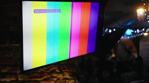 Television Displaying No Signal Screen in Dark Urban Setting