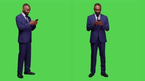 Smiling Man in Suit Using Smartphone on Greenscreen