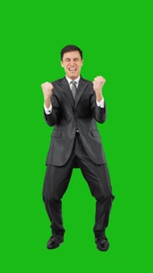 Excited Man Celebrating Victory in Studio Chroma Key