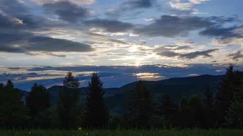 Experience the Breathtaking Beauty of a Mountain Sunset Landscape with Dramatic Clouds