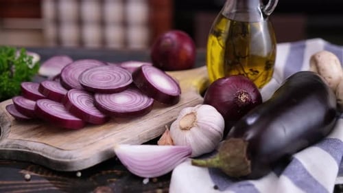 Sliced Red Onion on Wooden Cutting Board at Domestic Kitchen