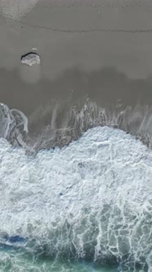 Vertical Video Aerial Perspective of a Sea Storm in the Mediterranean With Violent Waves and Flying