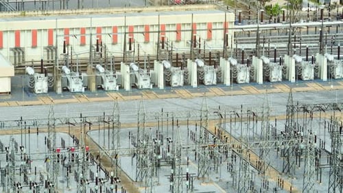 A high voltage power station from above by aerial view drone.