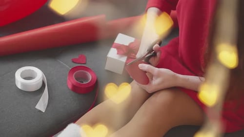 Woman Cutting Red Hearts For Valentine's Day