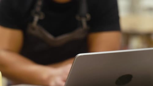 Close Up Male Carpenter Working At Laptop Slow Motion
